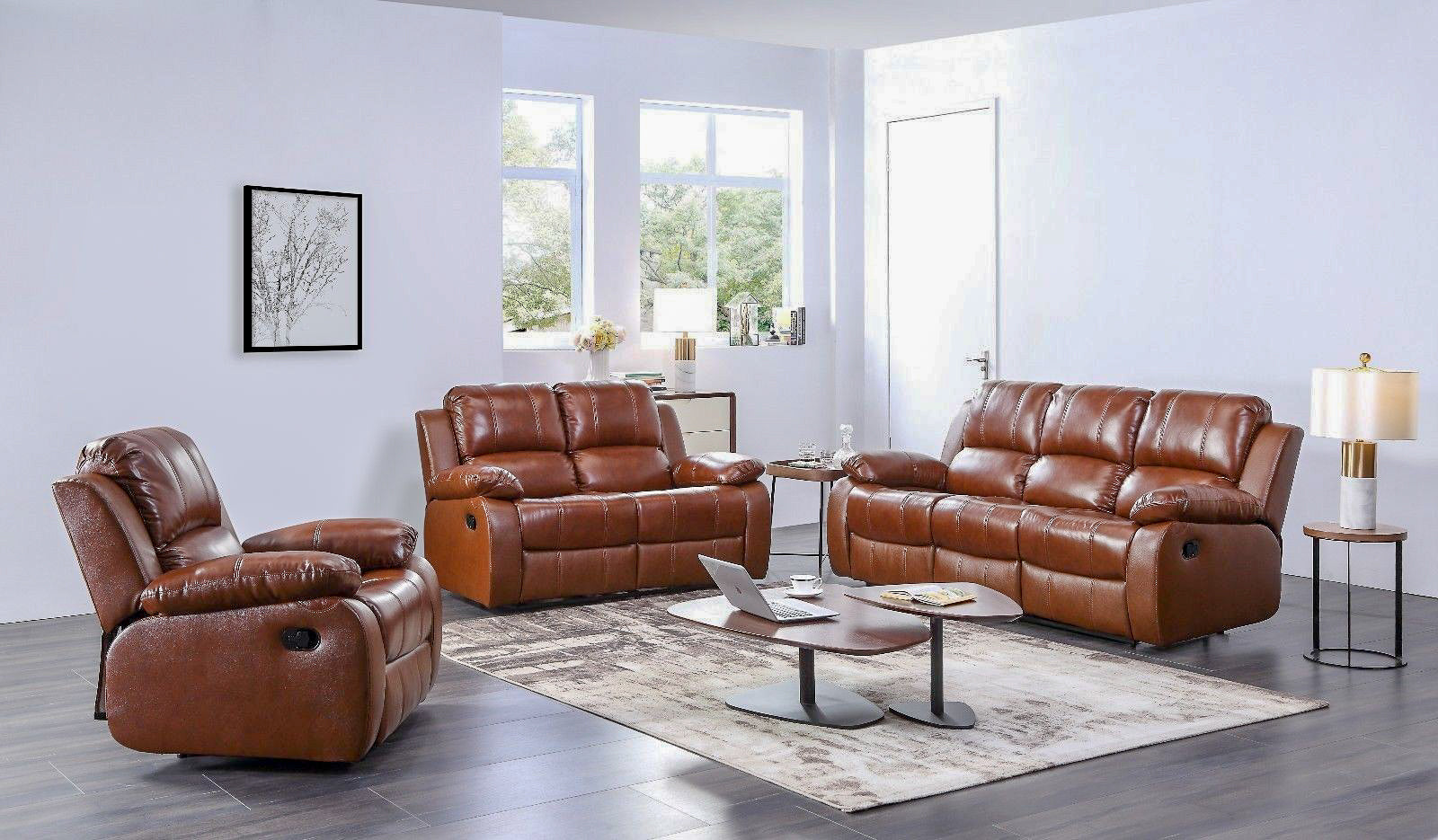 Brown leather sofa set in a living room with a coffee table and decor.