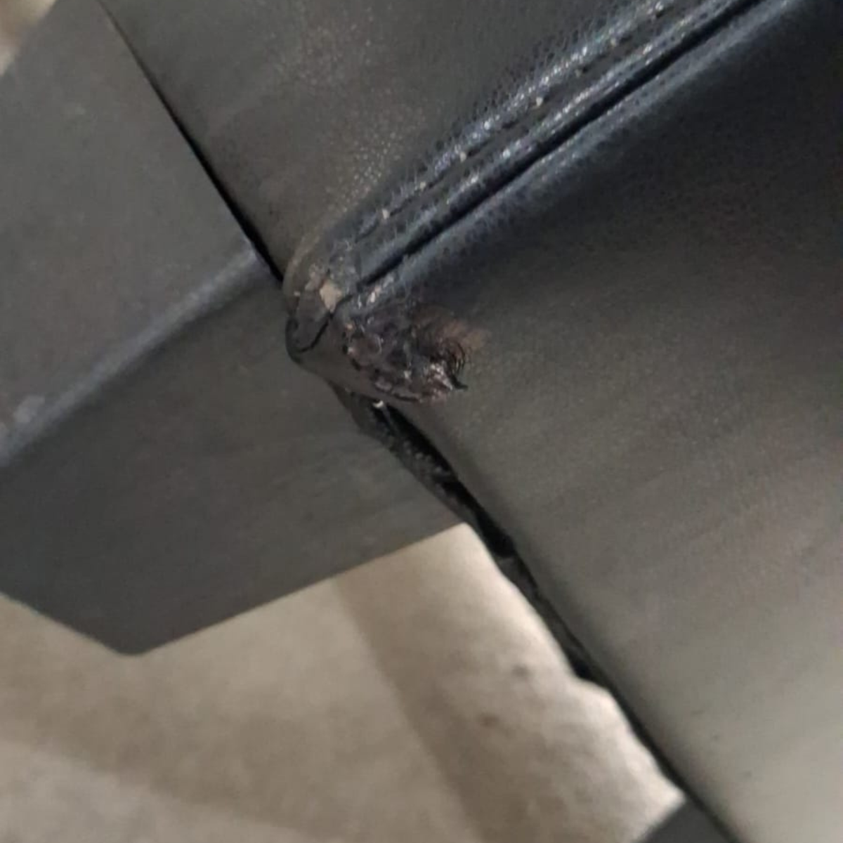 close up of black leather sofa
