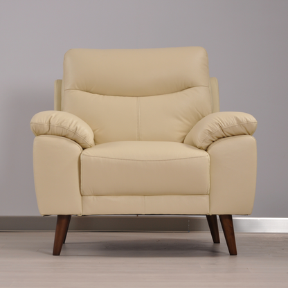 Vantage Cream Armchair in a modern living room setting with stylish décor, soft lighting, and neutral tones