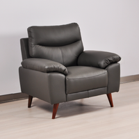 Vantage Grey Armchair, angled view in roomset, modern design, stylish and comfortable seating