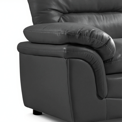 Close-up of a dark gray leather recliner chair on a white background