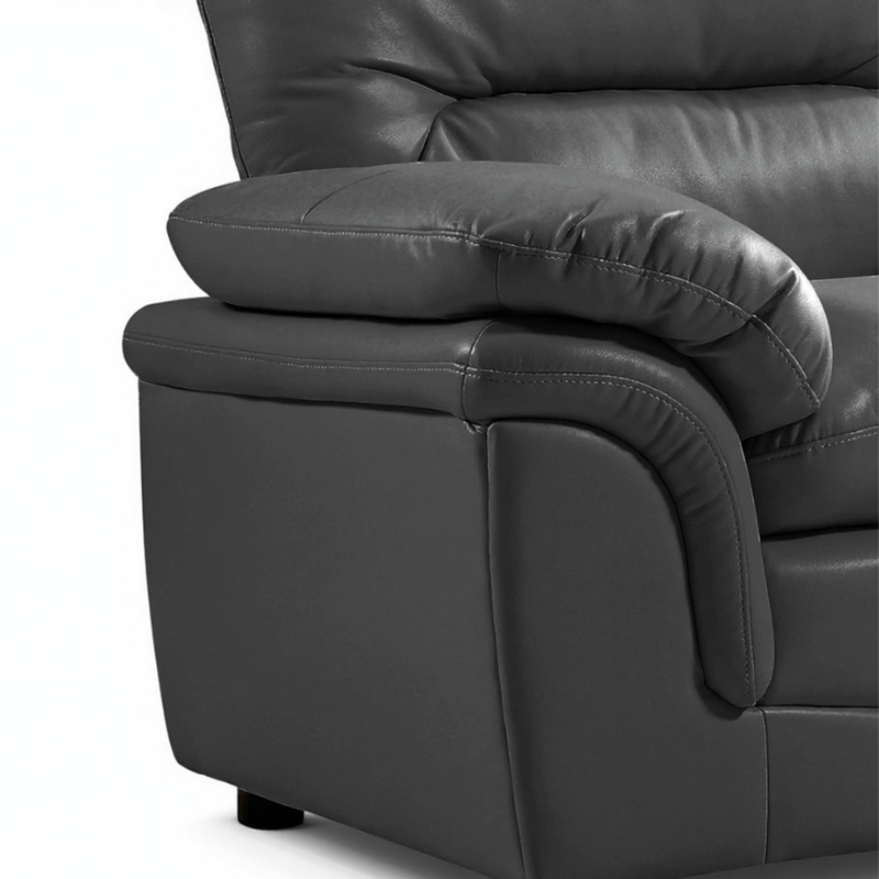 Close-up of a dark gray leather recliner chair on a white background