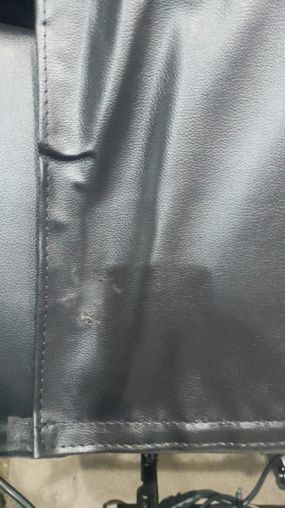 Close-up of black leather material with visible stitching