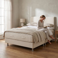 cream bed in a room setting