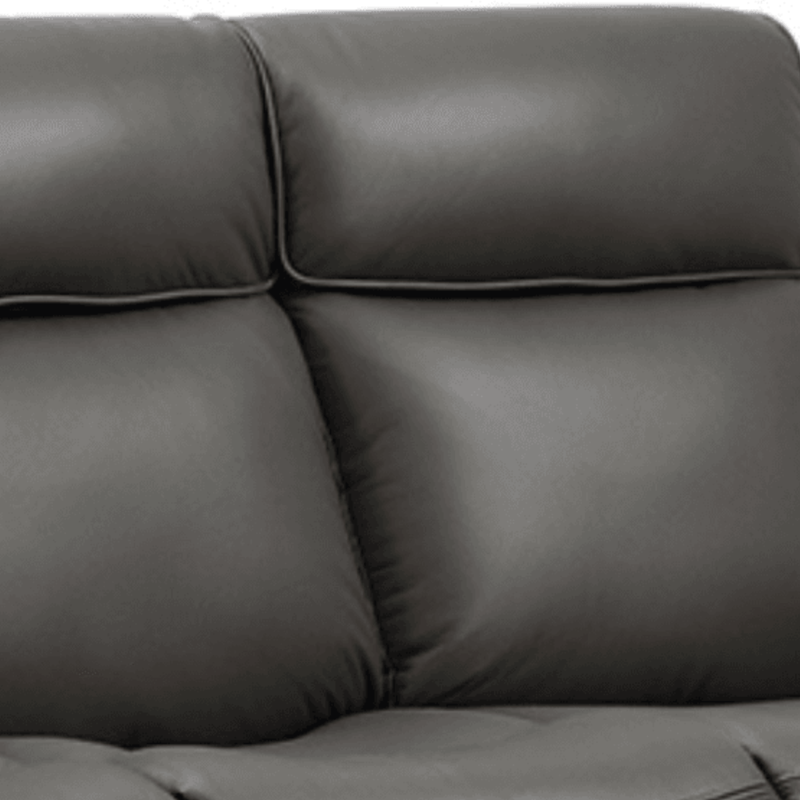 Gray leather sofa with a close-up view of the cushions.