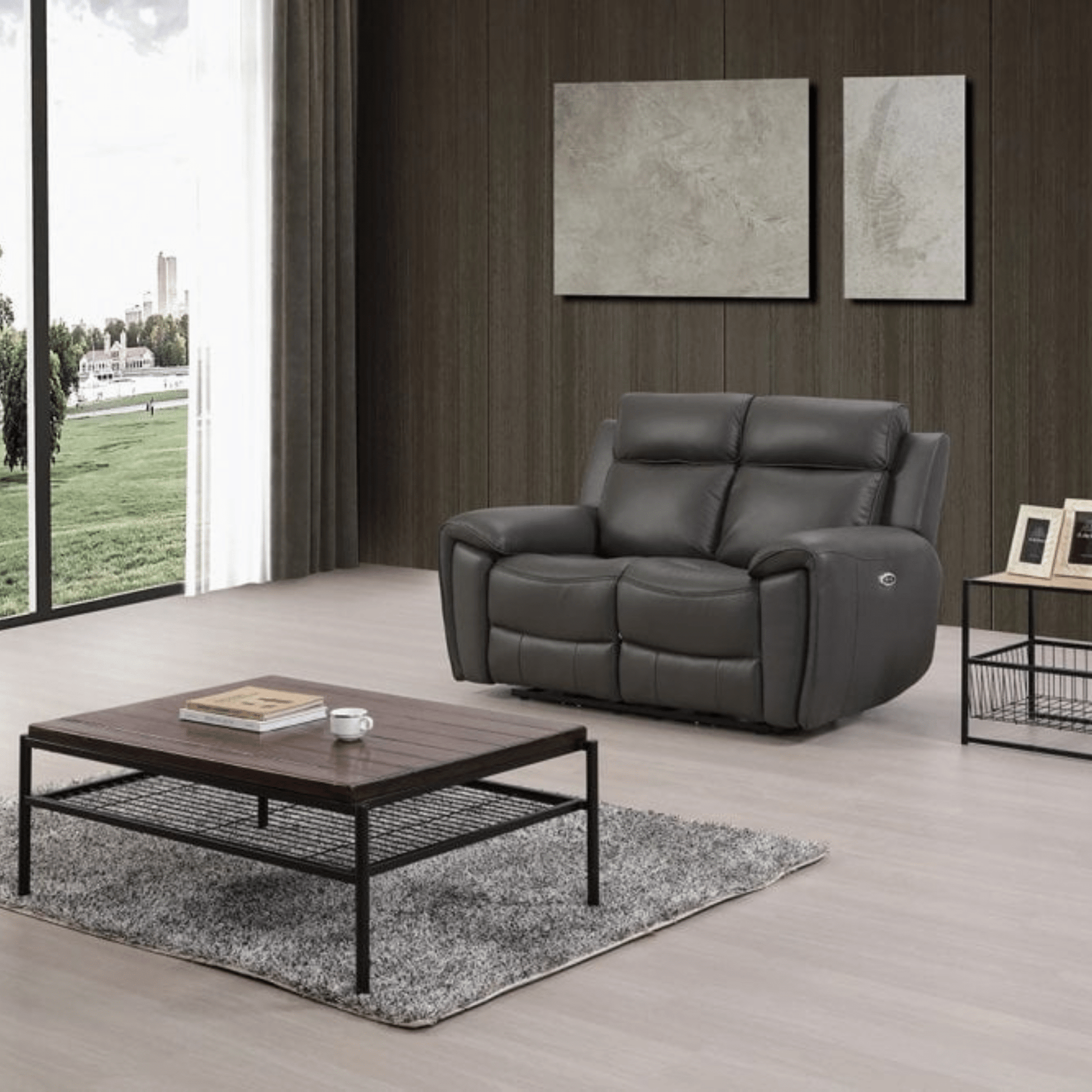 Gray recliner sofa in a modern living room with a wooden coffee table and decorative items.