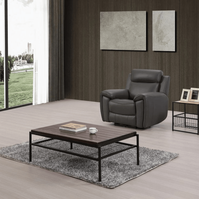 Modern living room with a gray recliner chair and wooden coffee table.