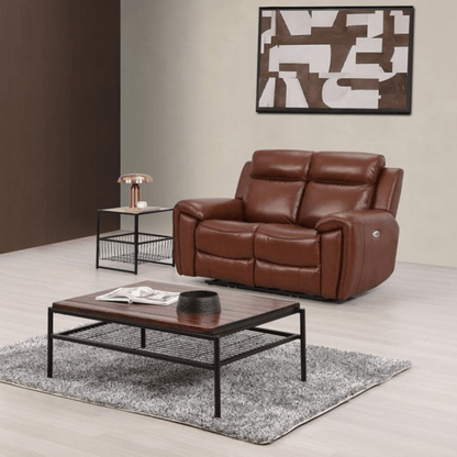Brown leather sofa in a living room setting with a coffee table and decorative elements.