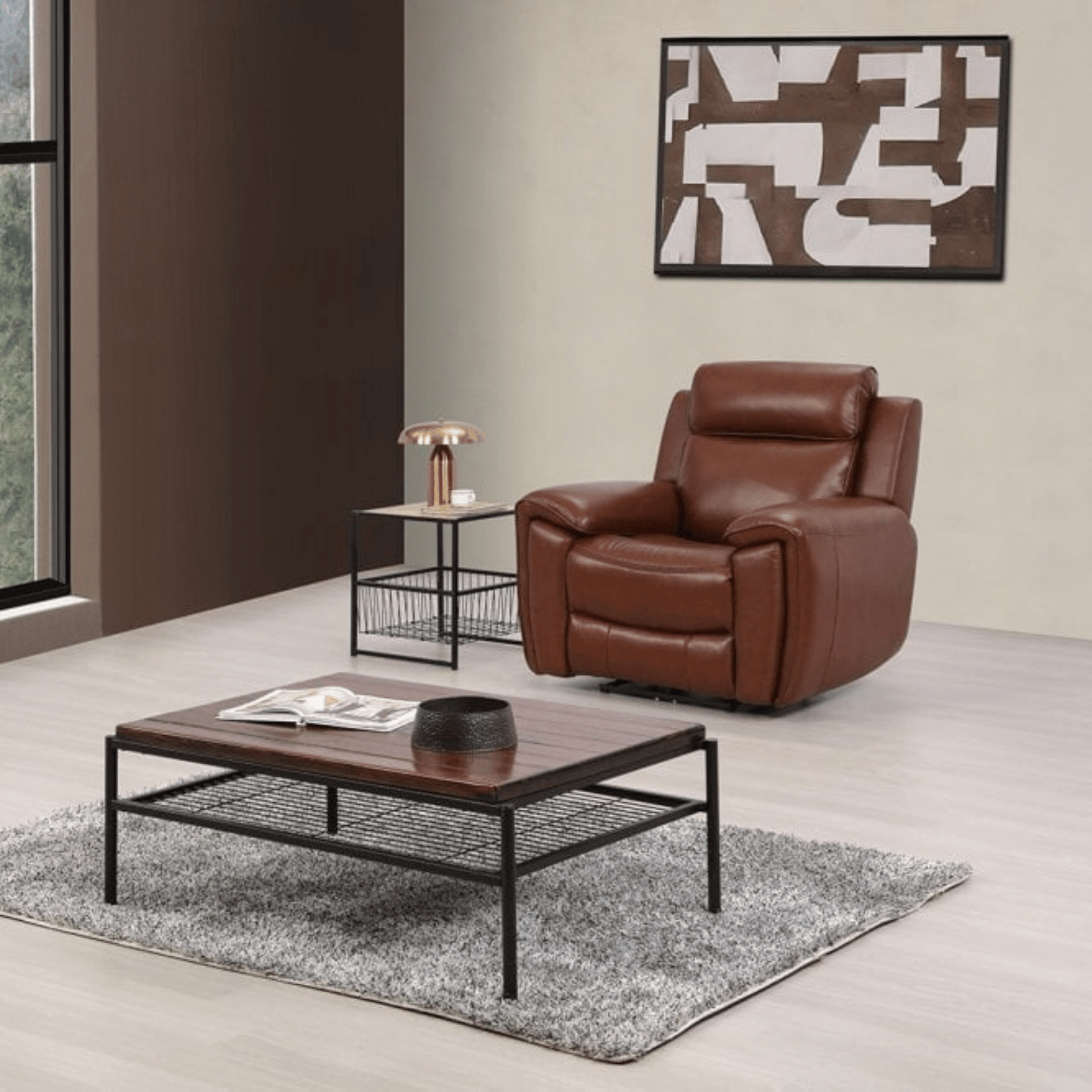 Brown leather armchair in a modern living room with a coffee table and abstract art on the wall.