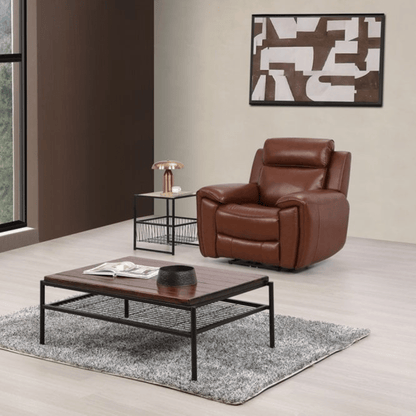 Brown leather armchair in a modern living room with a coffee table and abstract art on the wall.