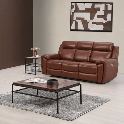 Brown leather sofa in a living room with a coffee table and decorative elements.