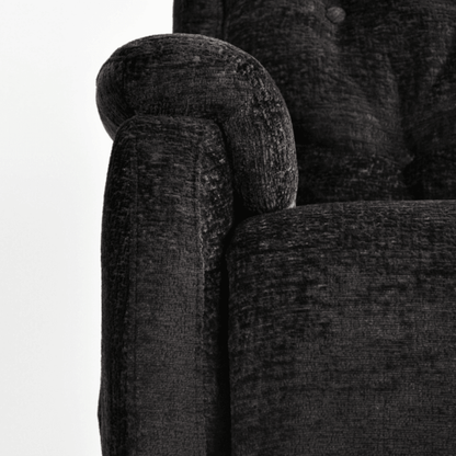 Close-up of a textured dark gray sofa with a white background