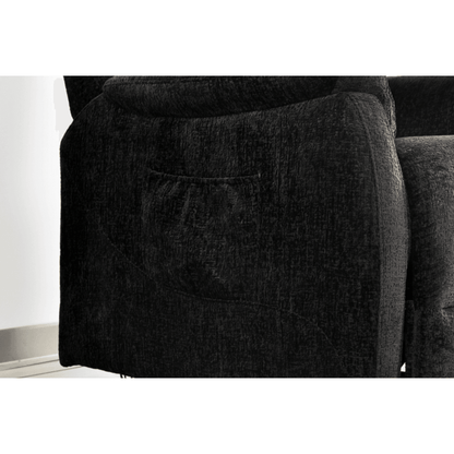 Close-up of a dark gray sofa with a pocket on the armrest.