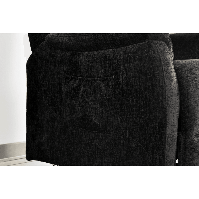 Close-up of a dark gray sofa with a pocket on the armrest.