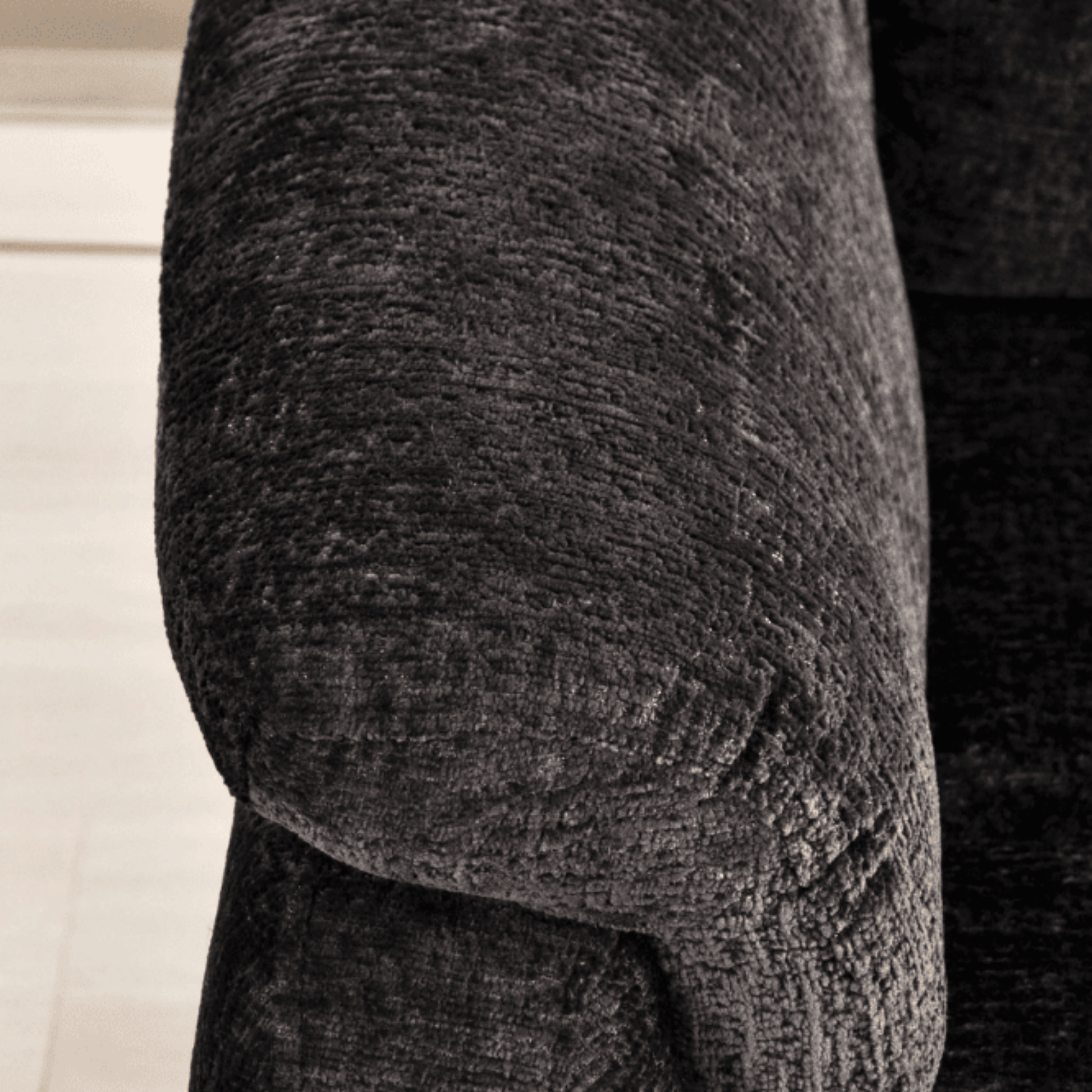 Close-up of a textured gray fabric surface