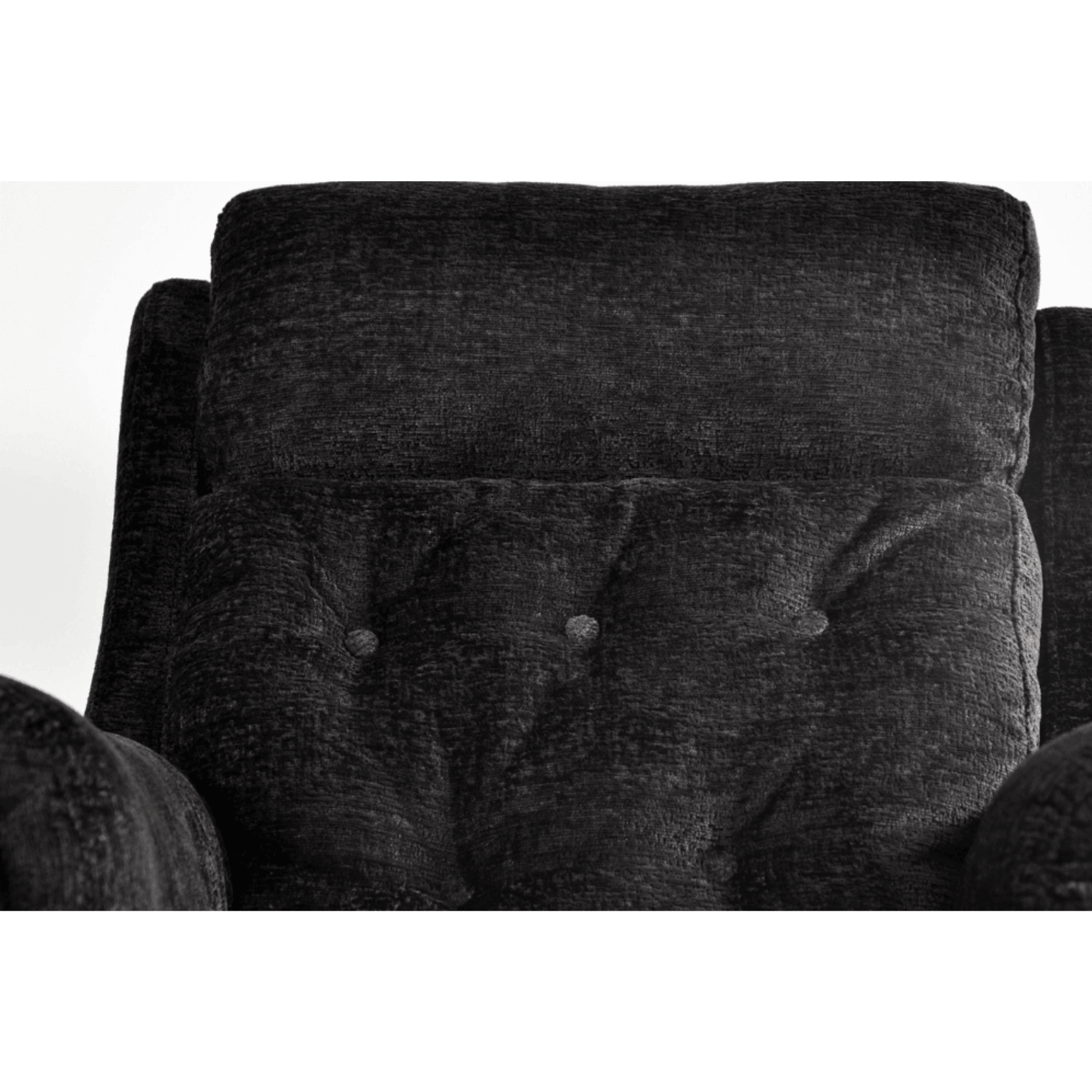 Close-up of a dark gray upholstered chair with button tufting on a white background