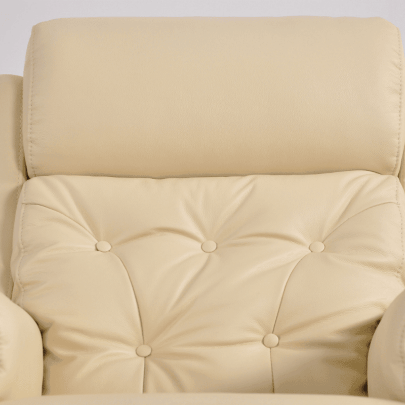 Beige upholstered chair with tufted backrest and armrests on a light gray background