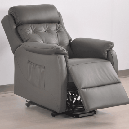 Gray recliner chair on a light wooden floor with a white wall background