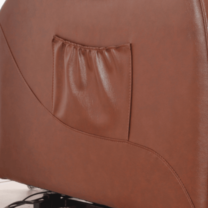 Close-up of a brown leather chair with a pocket on the backrest.
