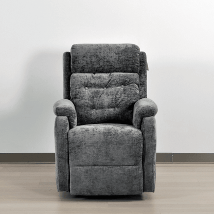 Gray recliner chair against a white wall
