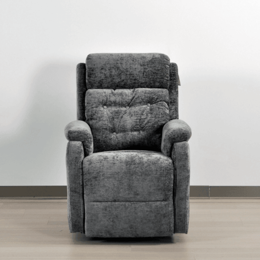Gray recliner chair against a white wall