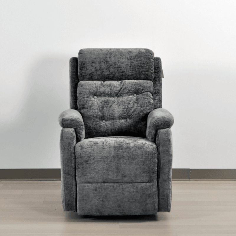 Gray recliner chair against a white wall