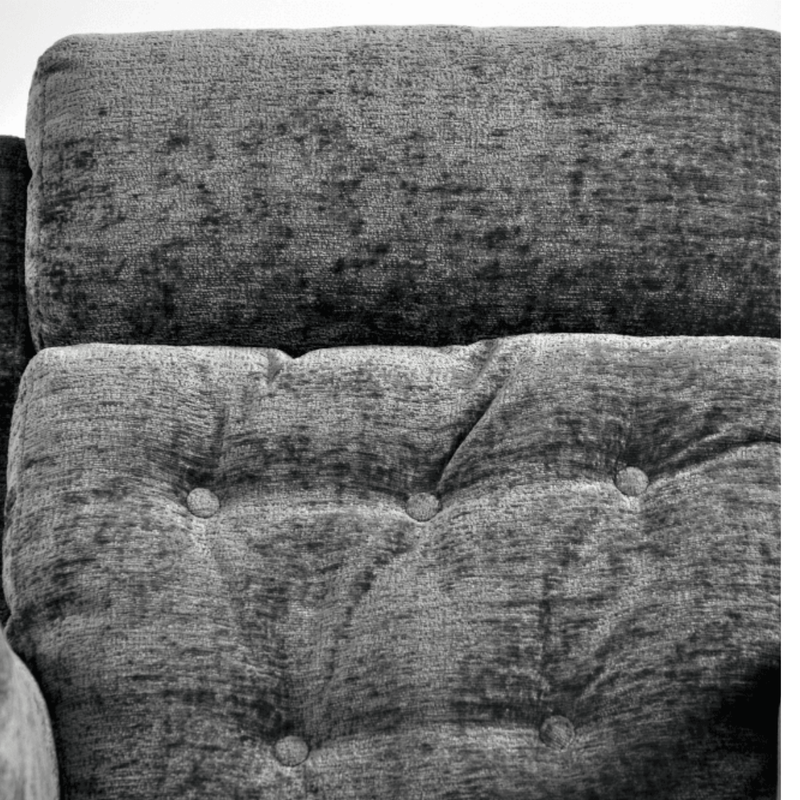 Close-up of a textured fabric surface with tufted design