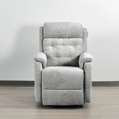 Gray recliner chair on a wooden floor with a white wall background