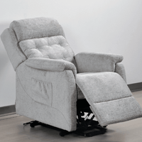 Gray recliner chair with armrests and footrest on a light gray background
