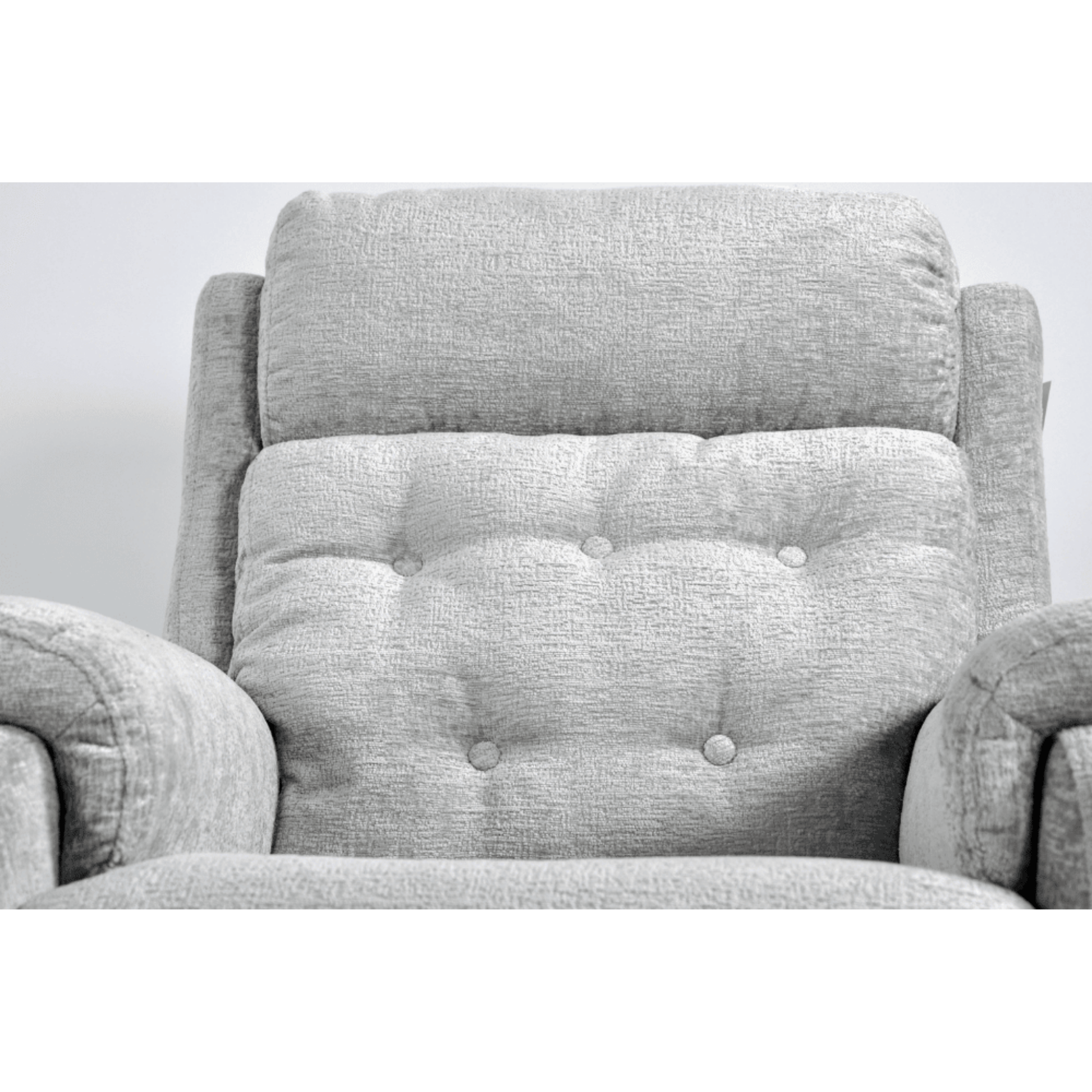 Gray upholstered chair with tufted backrest on a white background