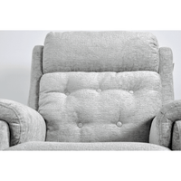 Gray upholstered chair with tufted backrest on a white background