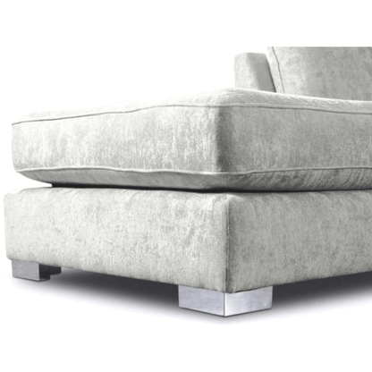 Gray fabric sofa with chrome legs on a white background