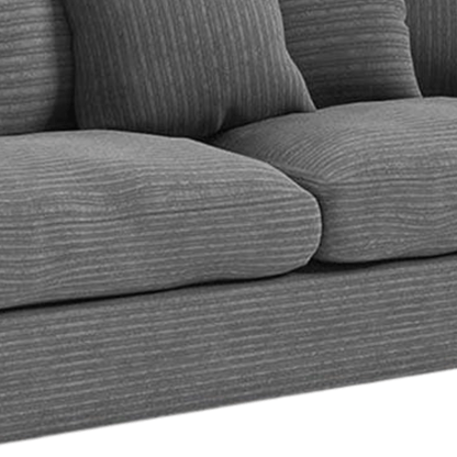 Gray sofa with textured fabric on a white background