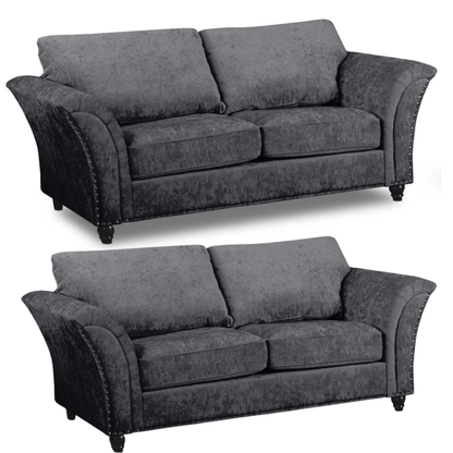 Two identical gray sofas on a white background