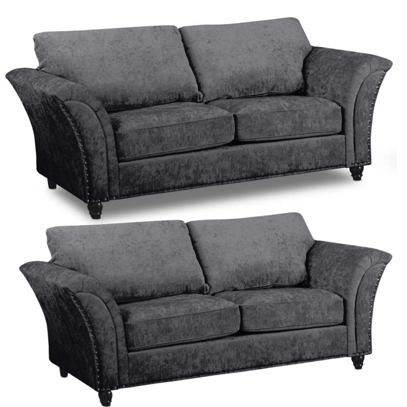 Two identical gray sofas on a white background