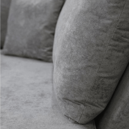 Gray textured pillows on a gray sofa