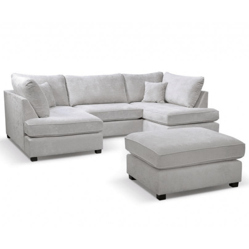Gray sectional sofa with matching ottoman on a white background