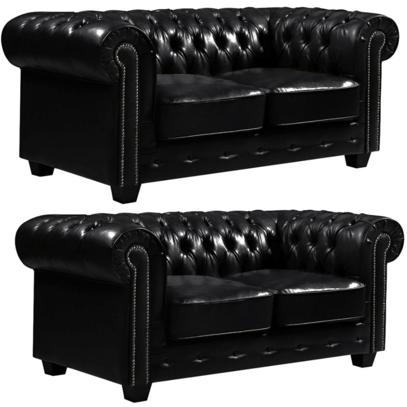 Two black leather sofas with tufted backrests on a white background