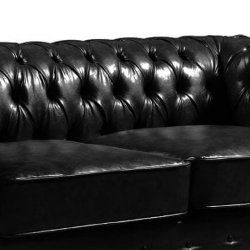 Black leather Chesterfield sofa on a white background