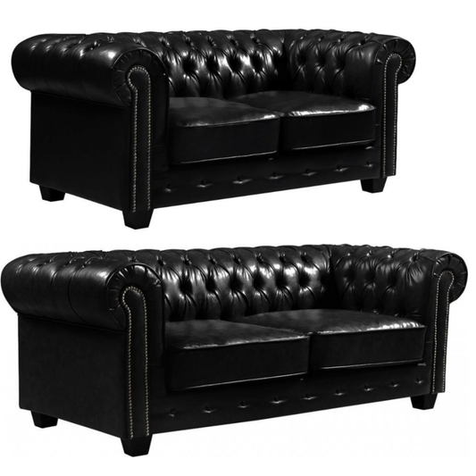 Two black leather sofas with tufted backrests on a white background