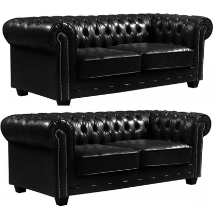 Two black leather sofas with tufted backrests on a white background