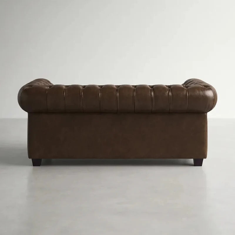 chesterfield-brown-leather-antique-2-seater-sofa-2-2-seater-sofa-set-patina-matching-british-furniture-view-front-side-close-corner-angle-texture-grain-stitched-hand-craftsmanship-timeless-style-collection