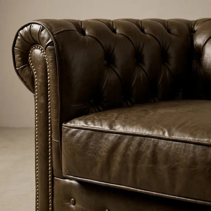chesterfield-brown-leather-antique-3-seater-sofa-3-2-seater-sofa-set-close-corner-angle-texture-grain-stitched-hand-craftsmanship-timeless-style-collection-effect-statement-piece-accent-instore-tufted-button