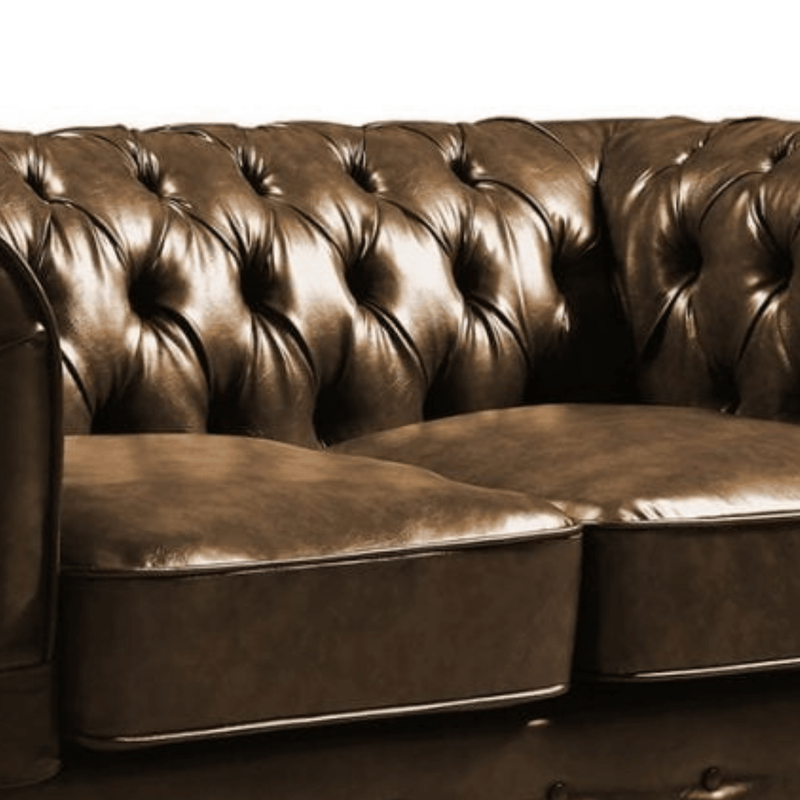 Brown leather sofa with tufted backrest on a white background
