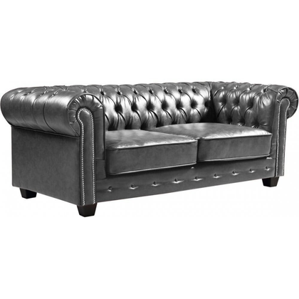 Gray tufted sofa on a white background