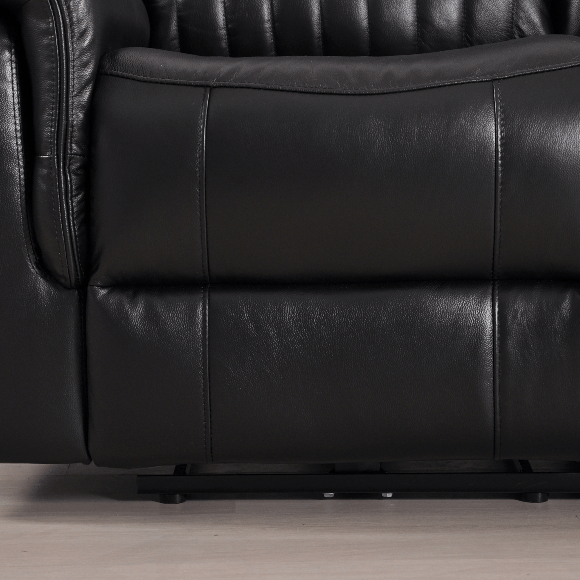 Closeup of Cidliano black 2-seater sofa showing fabric texture and design details on white background.