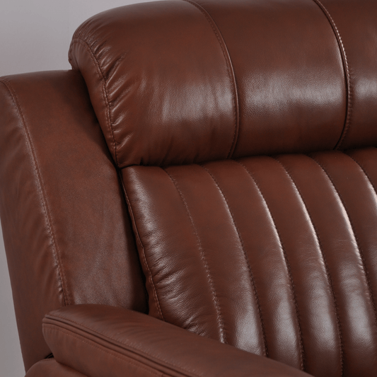 Closeup of Cidliano tan armchair showing fabric texture and design details.