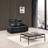 Black leather sofa in a living room with a wooden coffee table and city view.