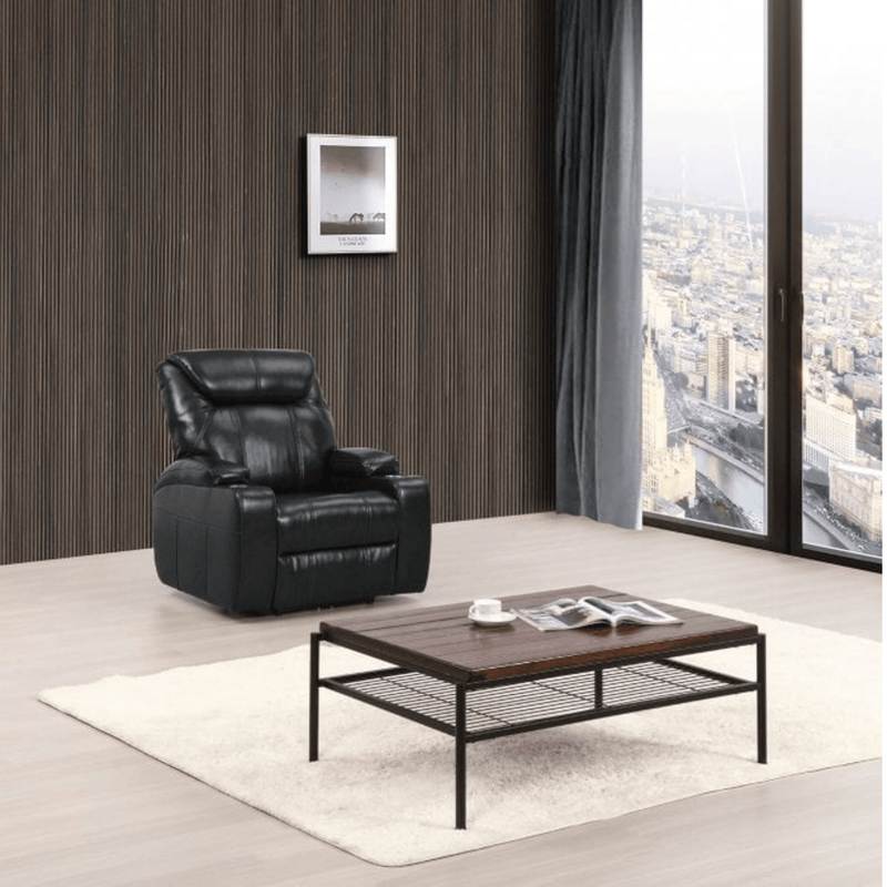 Modern living room with a black leather recliner chair and wooden coffee table.