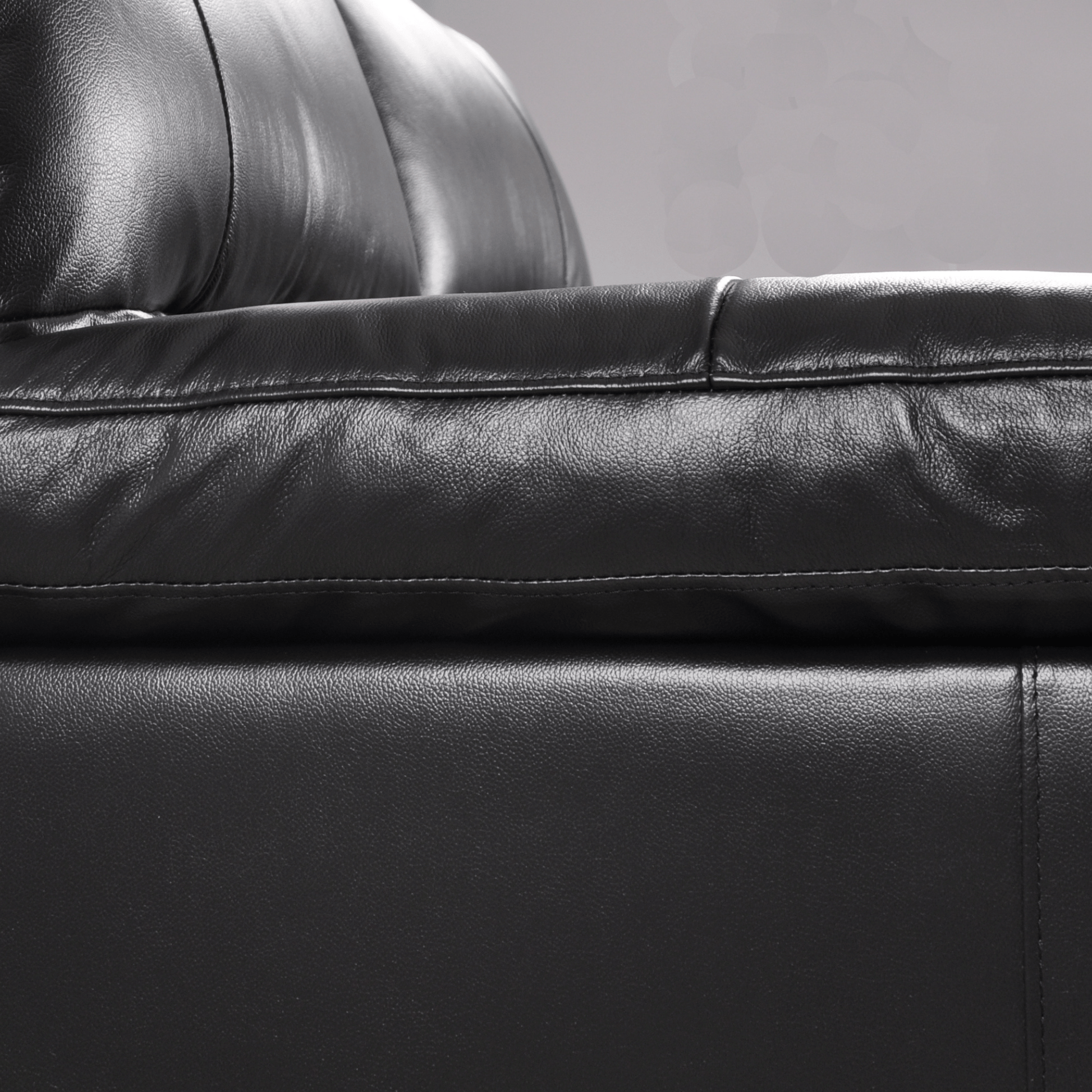 Dalmore Black 2-seater sofa close-up view on white background highlighting fabric texture and sleek design